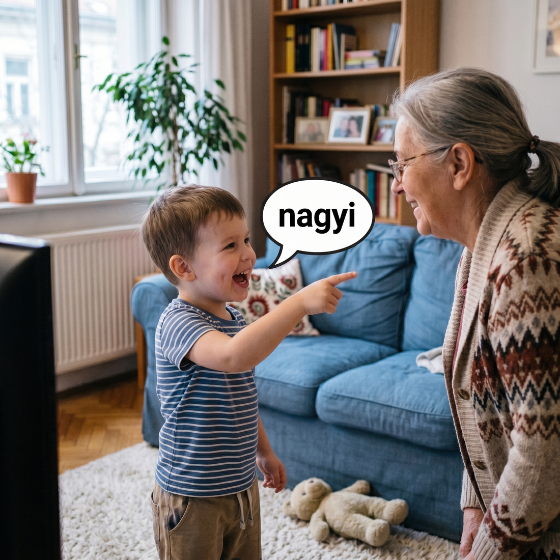 Lelkes kisfiú a szobában a nagymamájára mutat és a nagyi szót mondja, illusztrálva a mozgás és a beszédindító torna kapcsolatát